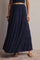 woman wearing a navy blue tiered maxi skirt with an elastic waistband and sandals
