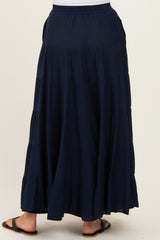 women's navy blue tiered maxi skirt with an elastic waistband, styled in a flowing, relaxed fit