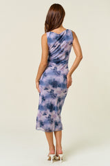 woman wearing a sleeveless purple and blue watercolor print midi dress, showing the back view