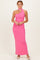 woman wearing a bright pink one-shoulder maxi dress with a fitted silhouette and a choker detail