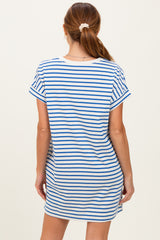 woman wearing a white and blue striped short sleeve dress, viewed from the back