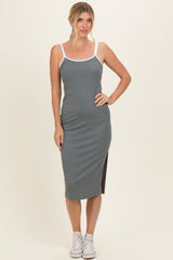 woman wearing a gray ribbed midi dress with white straps and side slit