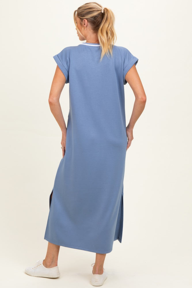 woman wearing a relaxed fit blue maxi maternity dress with short sleeves and side slits, showing her back