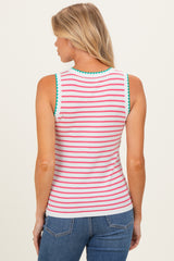 woman wearing a white striped maternity tank top with green and pink accents, viewed from the back