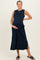 woman wearing a navy blue sleeveless maternity dress with side slits and holding her baby bump