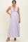 woman wearing a lavender maternity maxi dress with a plunging neckline and baby bump visible