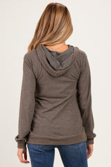 woman wearing a dark gray maternity hoodie with a back view and long sleeves