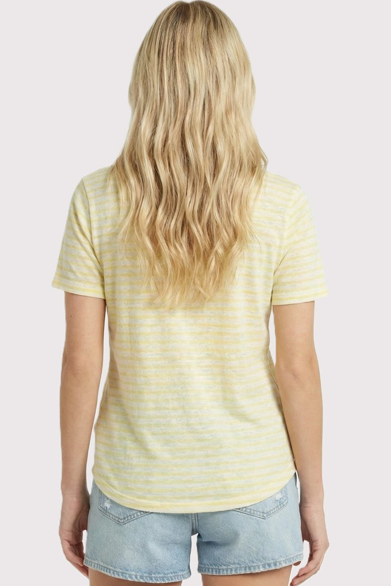 woman wearing a yellow striped short sleeve t-shirt with a rounded hem and casual denim shorts