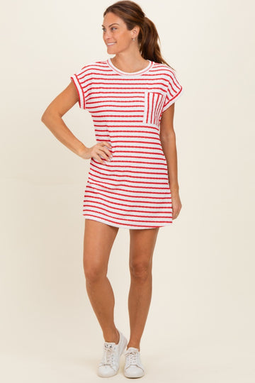 woman wearing a red and white striped short sleeve dress with a pocket