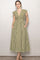 woman wearing a green and white gingham midi dress with cap sleeves and side pockets