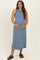 woman wearing a navy and white striped maternity maxi dress with a round neckline and holding her baby bump