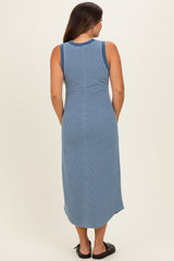woman wearing a blue and white striped maternity maxi dress, showing the back view and styling with sandals