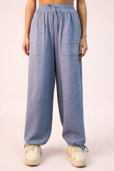 woman wearing light blue wide leg cargo pants with drawstring waist and pockets