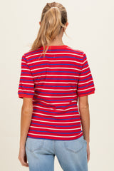 woman wearing a red and blue striped maternity t-shirt, shown from the back