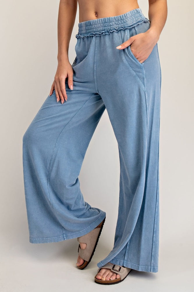 woman wearing light blue wide-leg pants with an elastic waistband and pockets