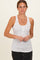 woman wearing a white maternity tank top with floral print and button details