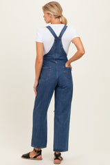 woman wearing a maternity denim overall with a white t-shirt, showing a relaxed fit and back view