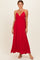 woman wearing a red sleeveless maxi dress with a plunging neckline and flowy silhouette
