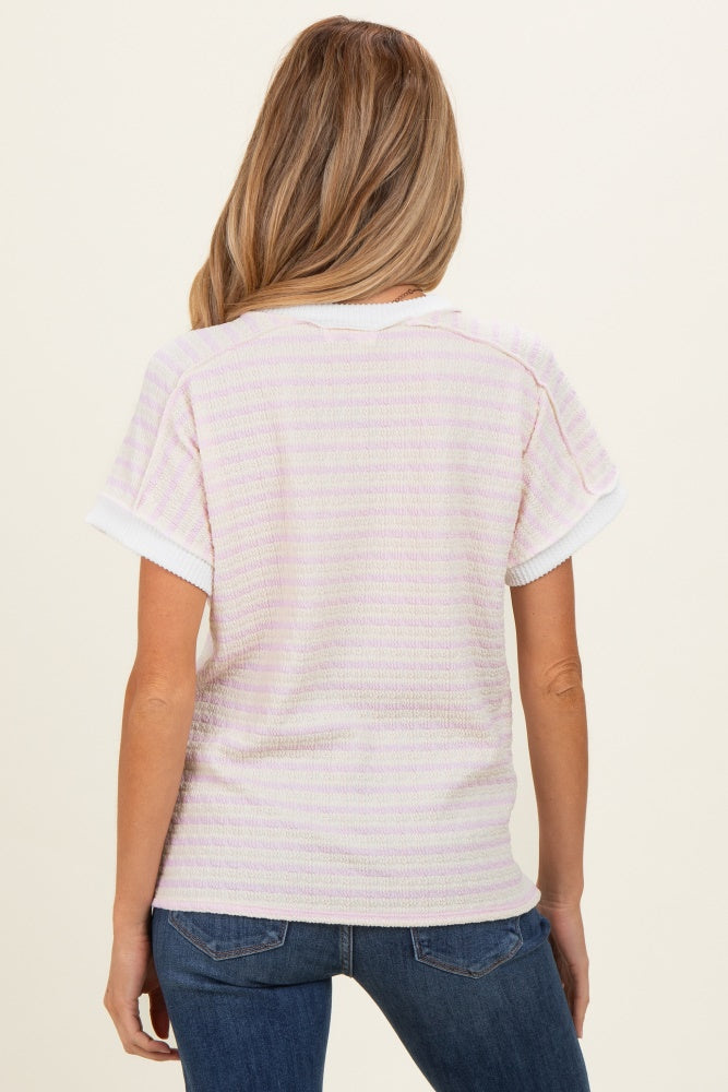 woman wearing a striped light purple maternity top with short sleeves, viewed from the back