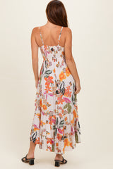 woman wearing a back view of a floral maxi dress with thin straps and a smocked bodice