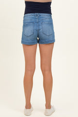 woman wearing light blue maternity denim shorts, showing the back view with a fitted waistband