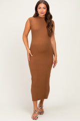 woman wearing a ribbed brown maternity dress with a sleeveless design and a fitted silhouette, showing her baby bump