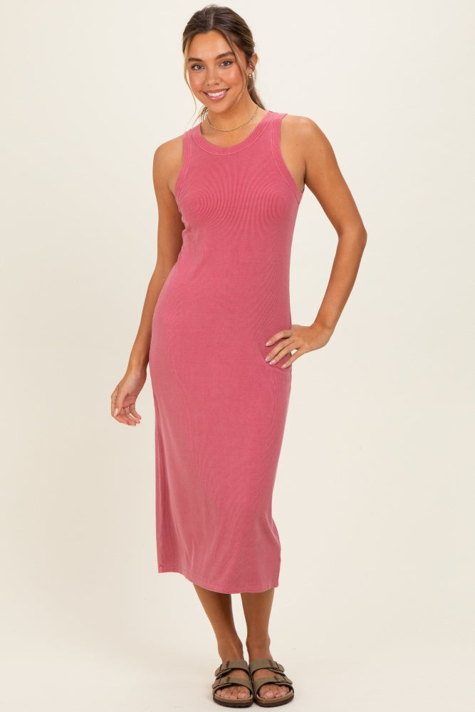 woman wearing a pink ribbed tank dress with a midi length and sandals, standing and smiling