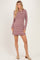 woman wearing a maroon and pink striped long sleeve dress with a relaxed fit and beige block heel shoes