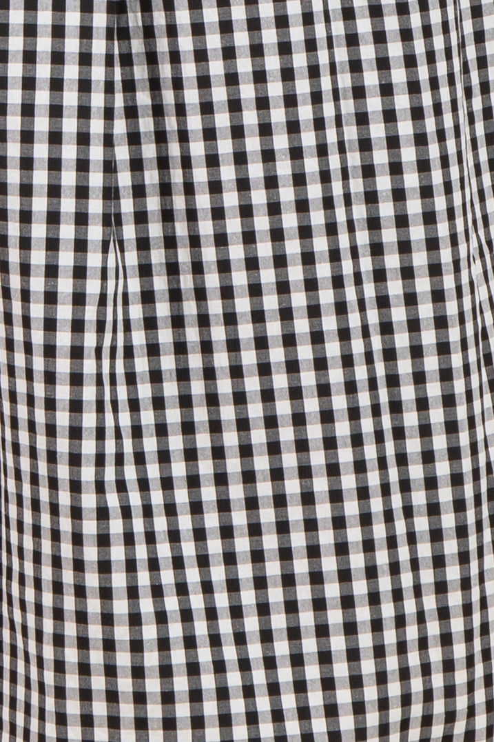 black and white gingham maternity wear fabric close-up with pleated details