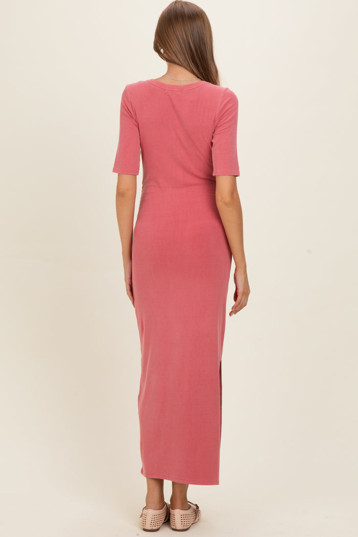 woman wearing a dusty rose maternity maxi dress with short sleeves and a back slit