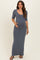woman wearing a grey half sleeve maternity maxi dress and holding her baby bump