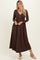 woman wearing a brown ribbed long sleeve maxi dress with a v-neck and button detailing