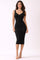 woman wearing a fitted black ribbed midi dress with a scoop neckline and slim straps
