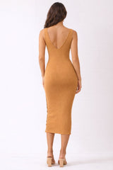 woman wearing a mustard ribbed midi dress with a deep v-back and side button detail