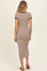 woman wearing a brown and cream striped maternity midi dress with short sleeves and a fitted silhouette