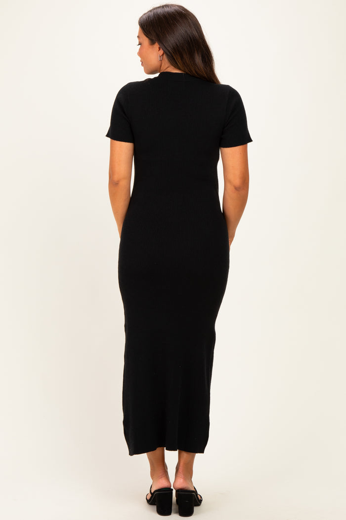 woman wearing a black short sleeve ribbed maternity dress, seen from the back