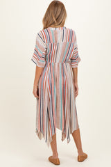 woman wearing a striped maternity dress with an asymmetrical hem and short sleeves, showing a relaxed fit from the back