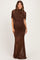 woman wearing a brown ruched maternity gown with short sleeves and a fitted bodice, highlighting her baby bump