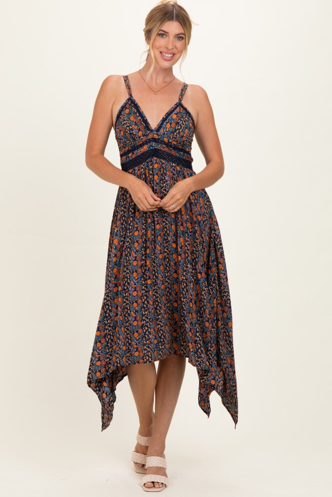 woman wearing a floral print high-low dress with lace details and adjustable straps