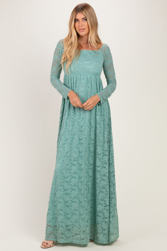 woman wearing a teal long sleeve lace maxi dress with a fitted bodice and flowing skirt