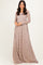 woman wearing a long sleeve taupe lace maxi dress with a flowy skirt