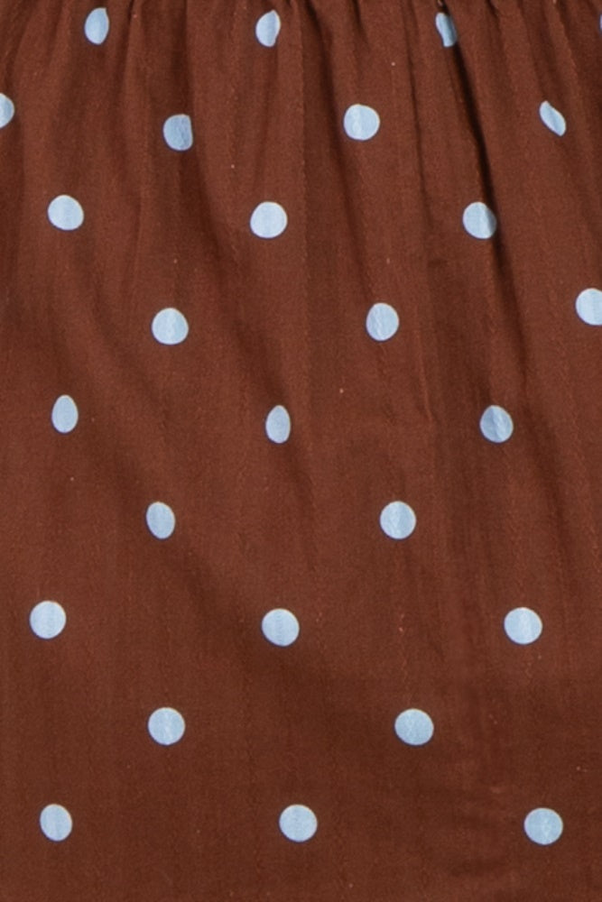 brown maternity dress with light blue polka dots and gathered waist detail