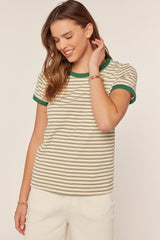 woman wearing a striped short sleeve t-shirt with green trim and a relaxed fit