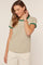 woman wearing a striped short sleeve t-shirt with green trim and a relaxed fit