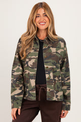 woman wearing a green camo maternity jacket over a black top with a relaxed fit and button details