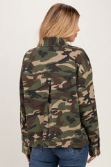 woman wearing a green camouflage jacket, seen from the back, with a relaxed fit and a collar