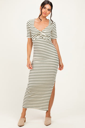 woman wearing a striped midi dress with a cinched front detail and short sleeves
