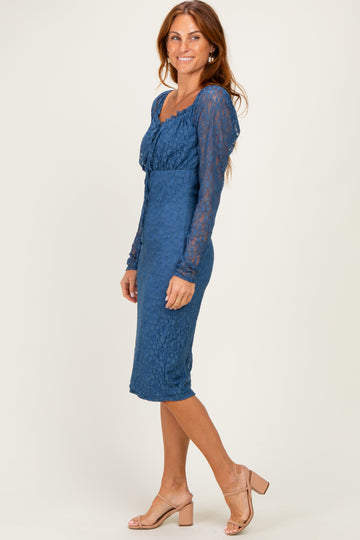 woman wearing a blue lace long sleeve midi dress with a fitted silhouette and a scoop neckline
