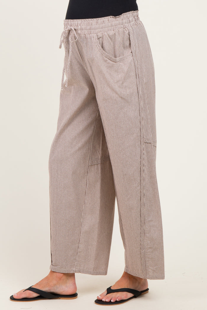 woman wearing striped maternity wide-leg pants with an elastic waistband and side pockets