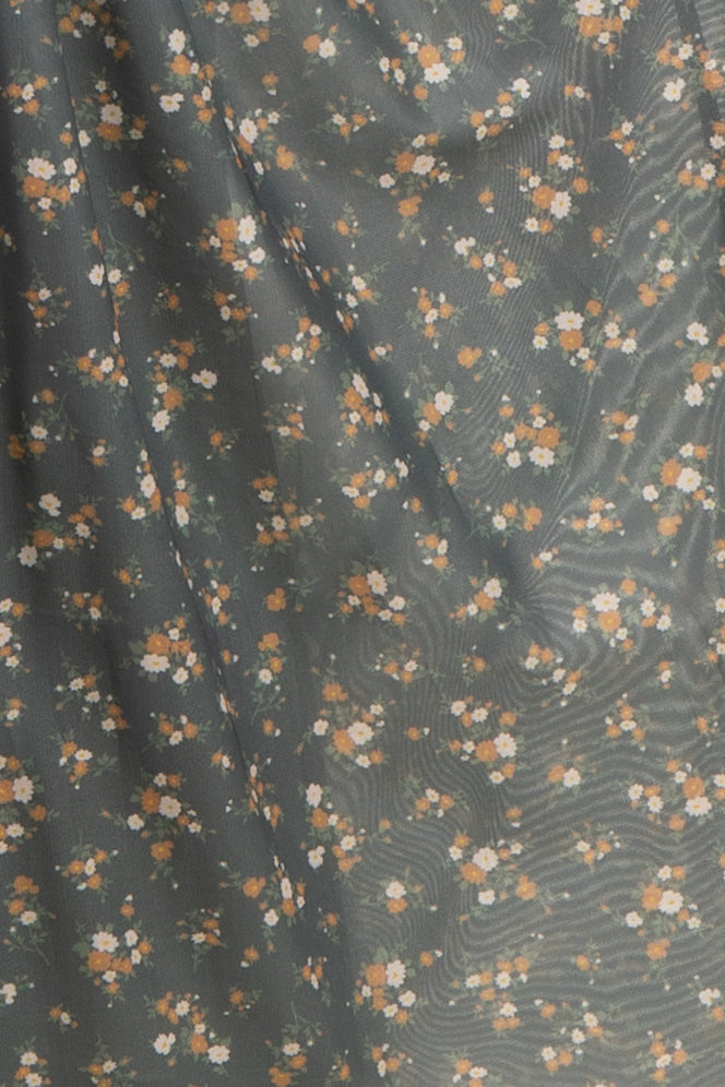 maternity wear in a gray floral print fabric with small orange and white flowers